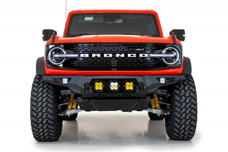 Addictive Desert Designs Bomber Front Bumper for Ford Bronco 2021-2023 with Baja Designs LP4 Mounts and D-Rings in Hammer Black